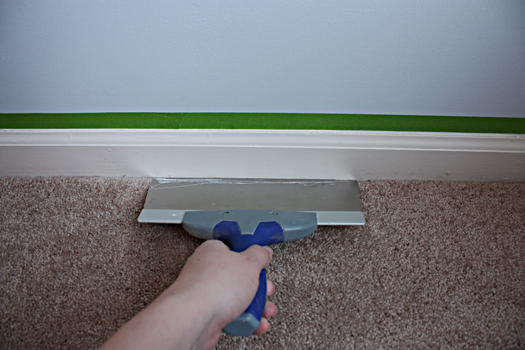 Use builders paper to protect carpet while painting baseboard