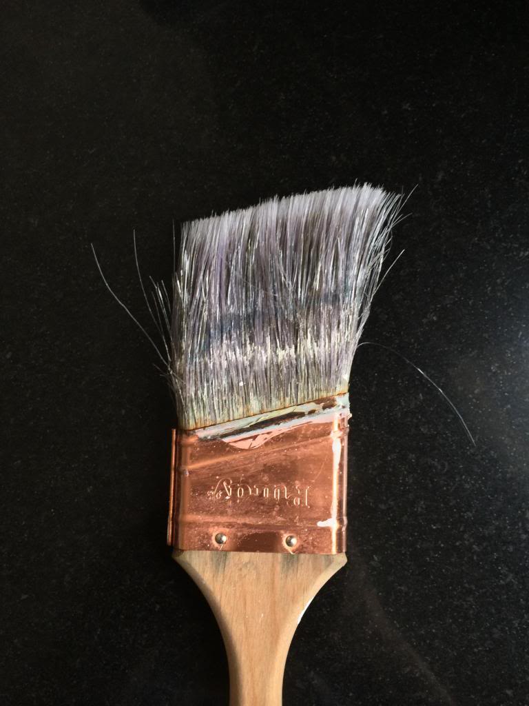 cleaning a paintbrush