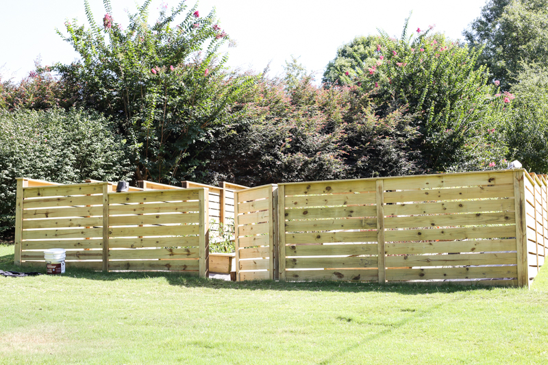 How to Build a Horizontal Plank Fence in a Hillside Backyard