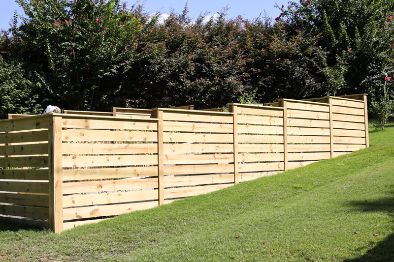 How to Build a Horizontal Plank Fence in a Hillside Backyard