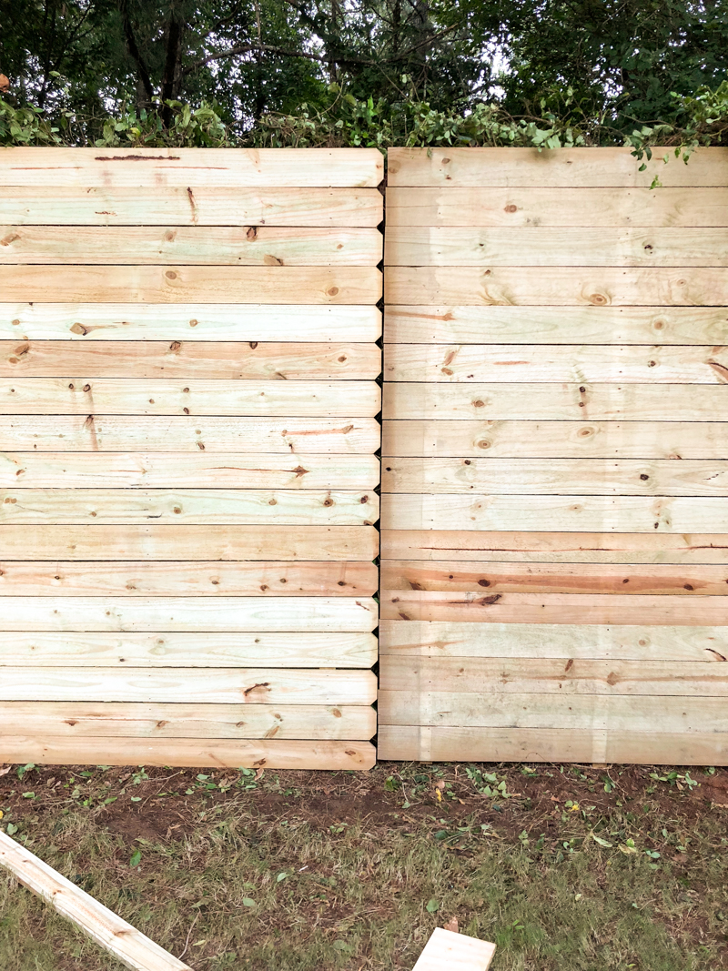 How to Build a Horizontal Plank Fence in a Hillside Backyard